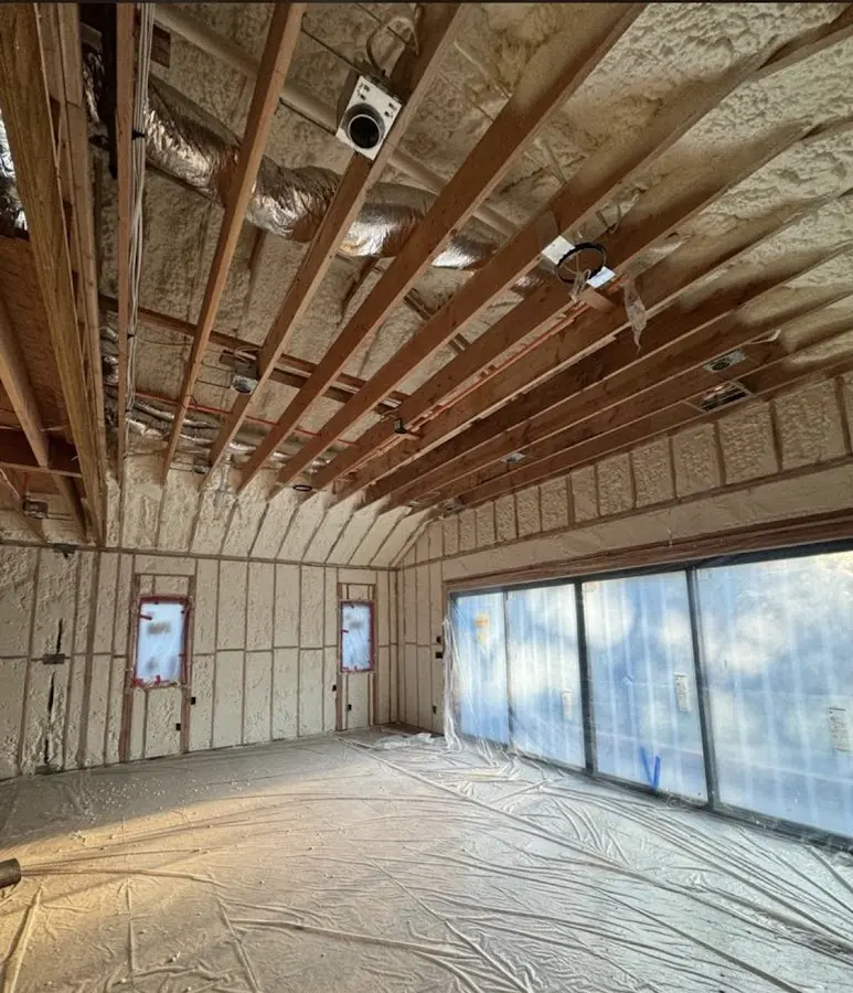 Interior walls and ceiling insulated with spray foam during new construction in Country Club